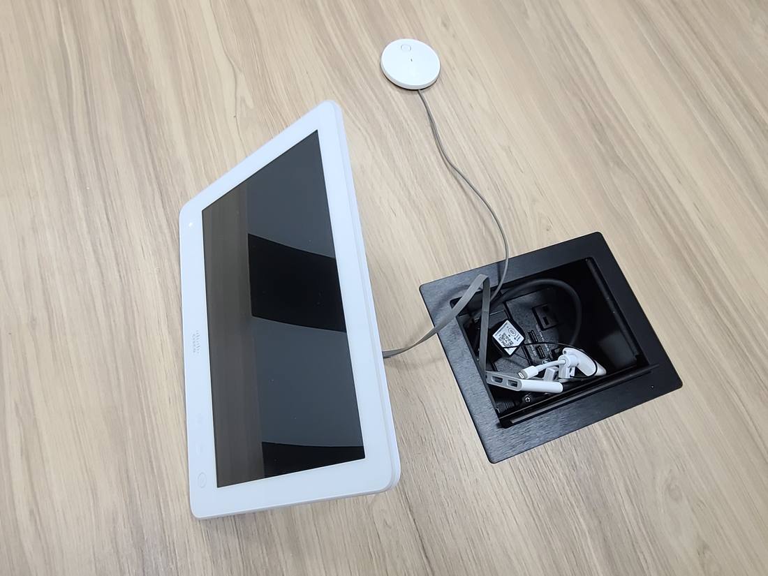 Tabletop control tablet beside a recessed power module