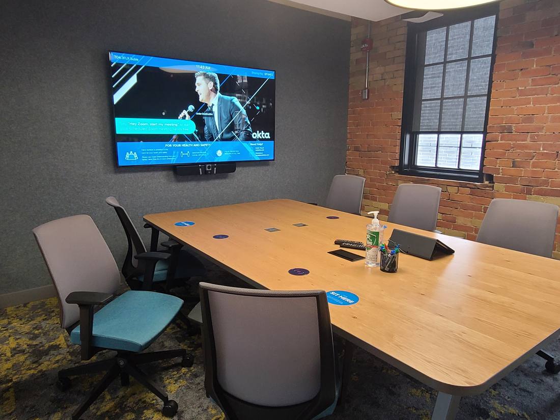 Zoom room with exposed brick feature wall