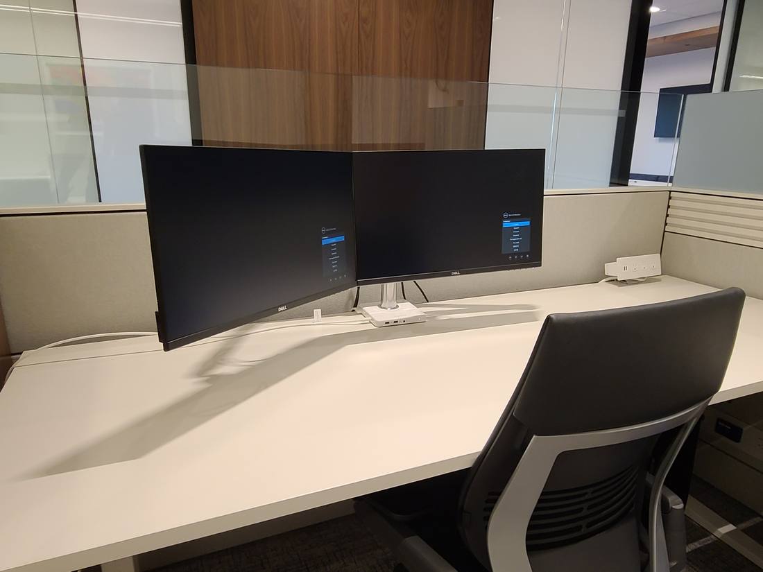 Dual-monitor workstation in an open-office cubicle