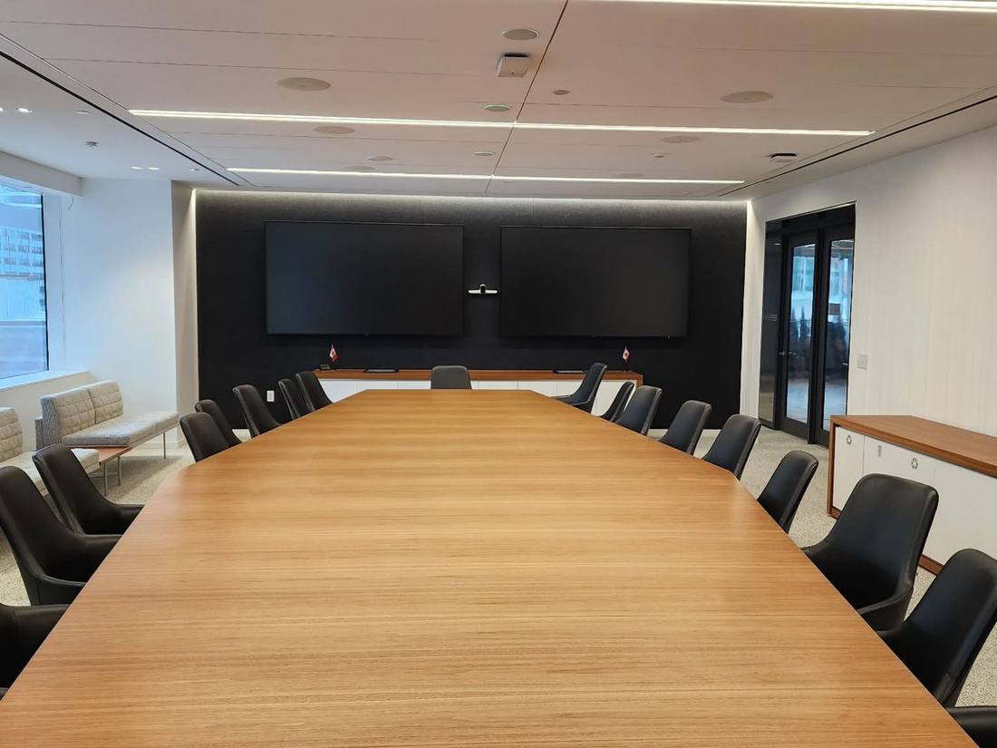 Sixteen-seat corporate boardroom with dual displays