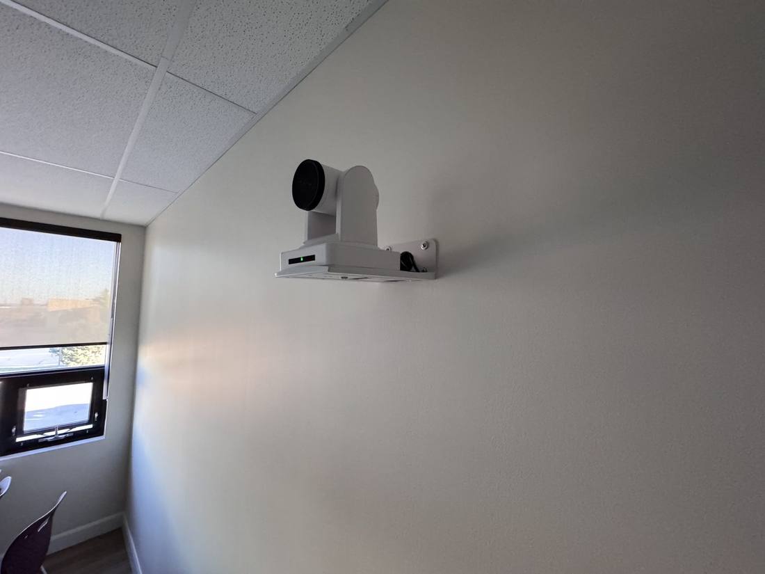 Ceiling-mounted PTZ camera in a classroom