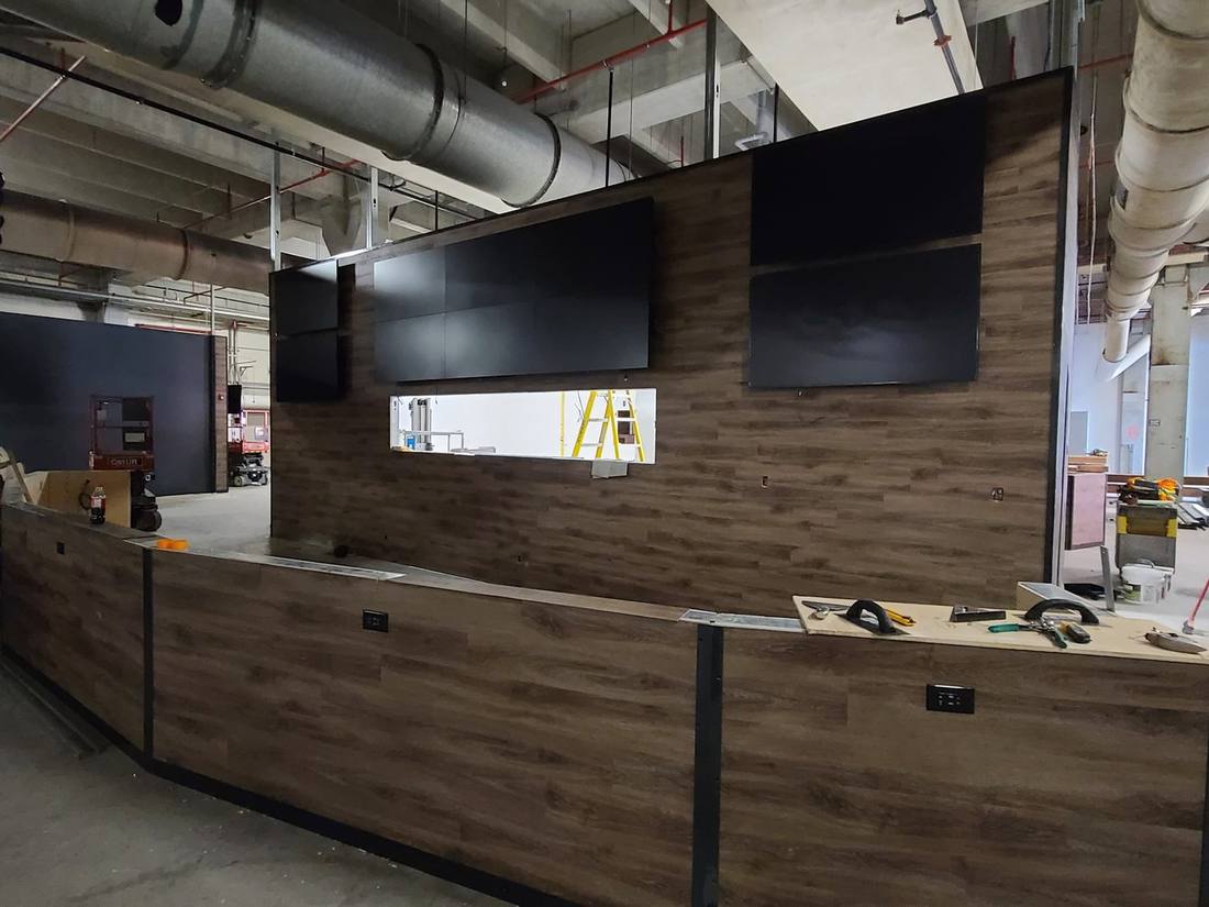 Reception counter under construction with four mounted displays