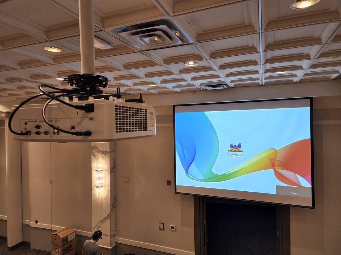 Ceiling projector and motorized screen showing ViewSonic test pattern
