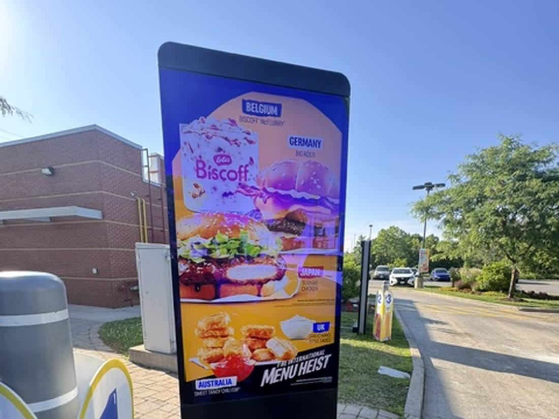Outdoor drive-thru digital menu board totem