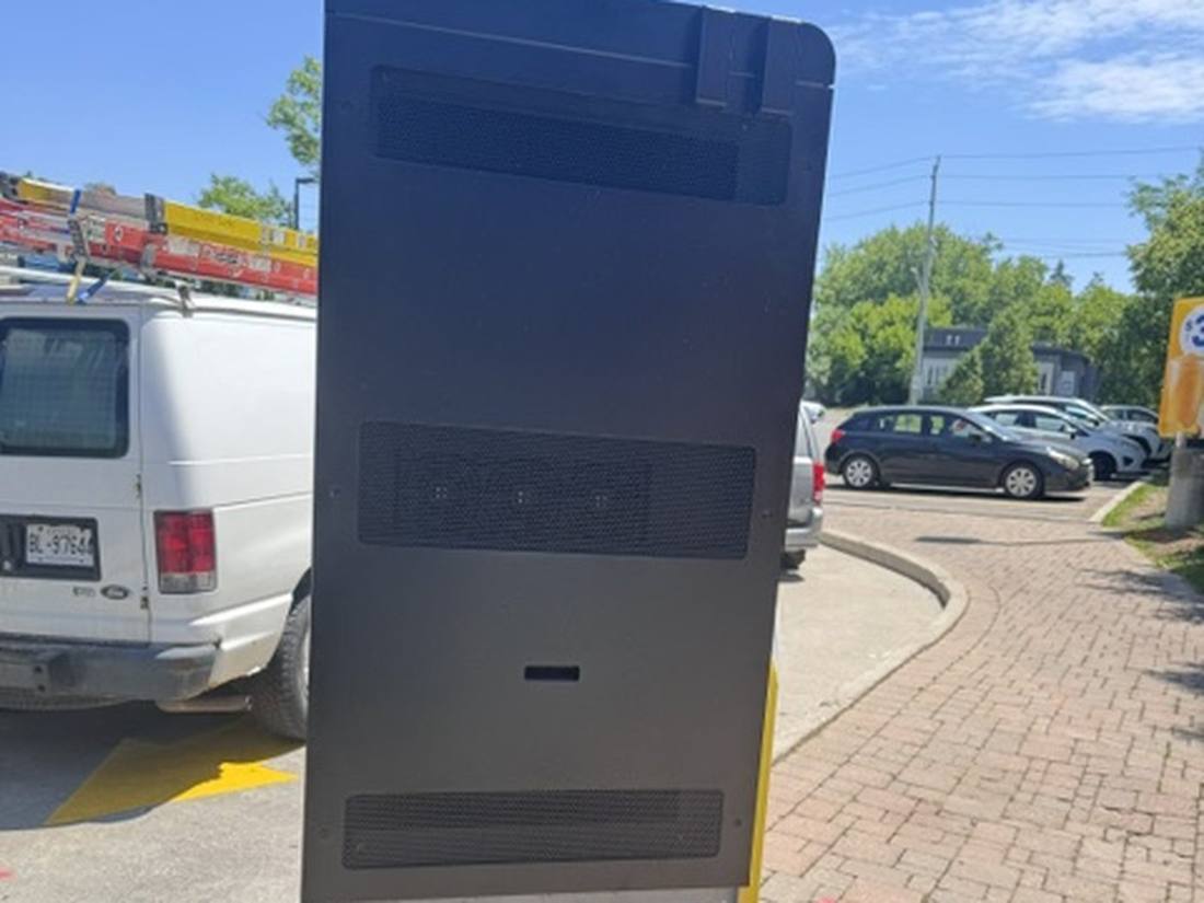 Rear access panel of a digital menu board totem