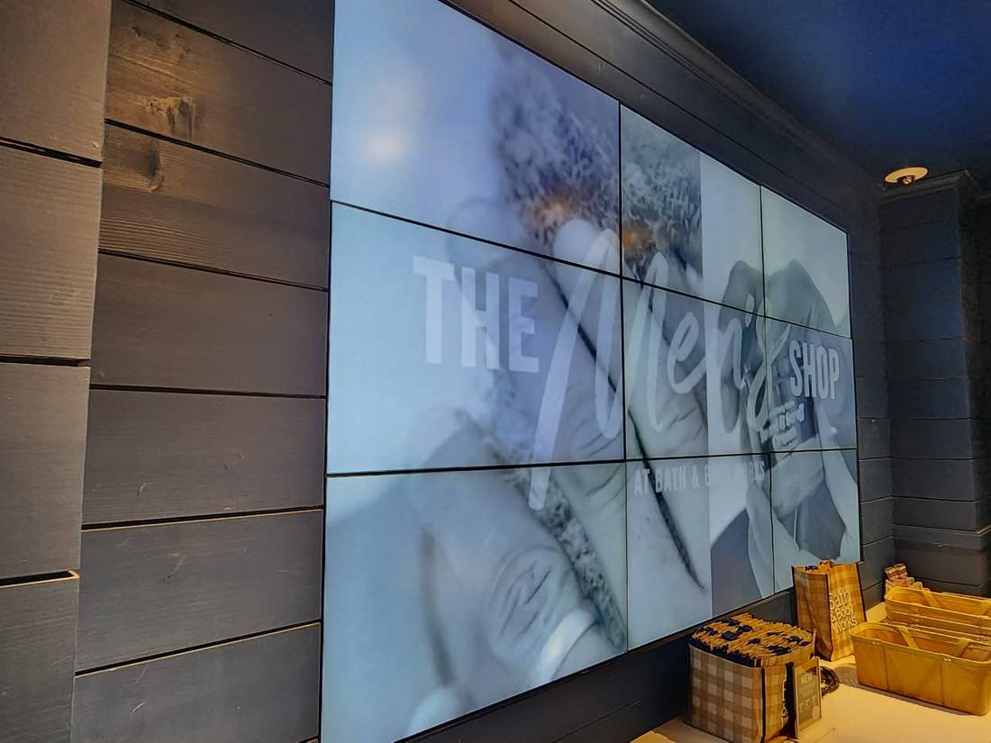 In-store video wall built into a shiplap feature wall